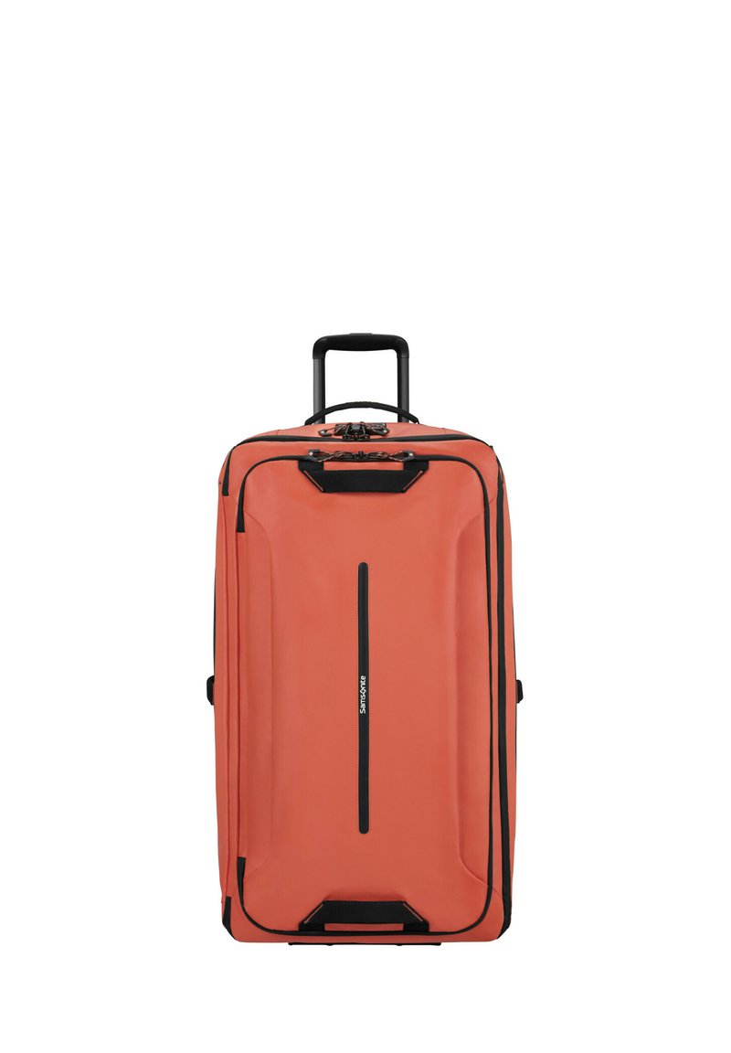 Large, rectangular coral suitcase with black hardware, a telescopic handle, and a vertical zipper closure. Textured surface for durability.