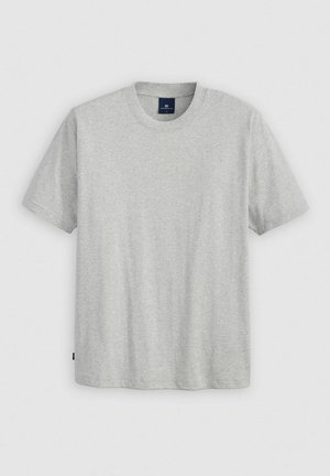 Gray short-sleeve T-shirt made of soft, textured fabric. Features a crew neck and a subtle brand label at the bottom left.