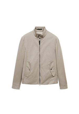 Giacca beige chiaro con colletto a costine, zip frontale e due tasche laterali inclinate. Realizzata in tessuto liscio con cuciture minime.
