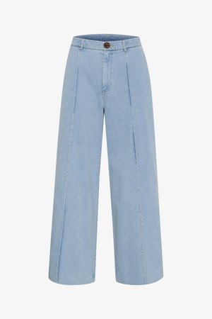 Jeans larges en denim bleu clair, dotés d'une fermeture à bouton et de deux coutures frontales verticales.