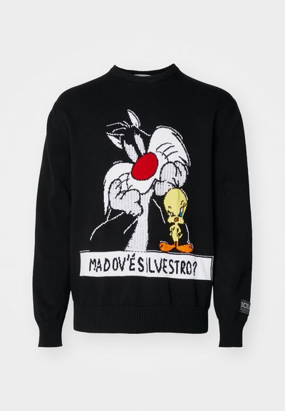 Pull en tricot noir avec une illustration de Sylvester le Chat et Tweety Bird, avec des accents rouges et blancs et des poignets côtelés.