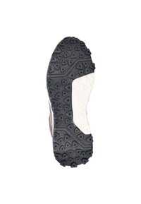 Rubber shoe sole with a black textured surface and triangular patterns, featuring a white midsole and a brown upper section at the heel.