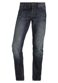 Džínové kalhoty v tmavě modré barvě s mírným vyblednutím, design s pěti kapsami a kovovými detaily. Rovný střih s hladkou texturou.