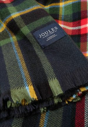 Sciarpa di lana con motivo scozzese scuro in rosso, verde e giallo, caratterizzata da un bordo sfrangiato e un'etichetta del marchio Joules cucita.