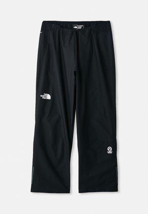 Pantalons d'extérieur noirs en matériau léger et durable. Comprend des logos à l'avant et à l'arrière, des fermetures éclair aux chevilles et une coupe décontractée.