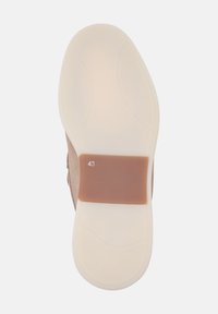Schoenzool in beige rubber met een gladde textuur, voorzien van een bruine accenten en maat 43 gedrukt. Ronde vorm met subtiele ontwerp lijnen.