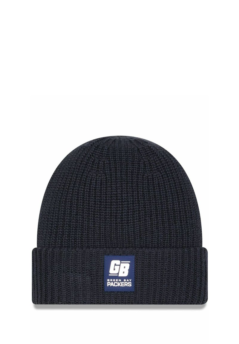 Marineblaue gestrickte Mütze mit gerippter Textur und umgeschlagenem Bündchen. Besitzt ein weiß-blaues Patch, das "GB" und das Logo der "Green Bay Packers" zeigt.