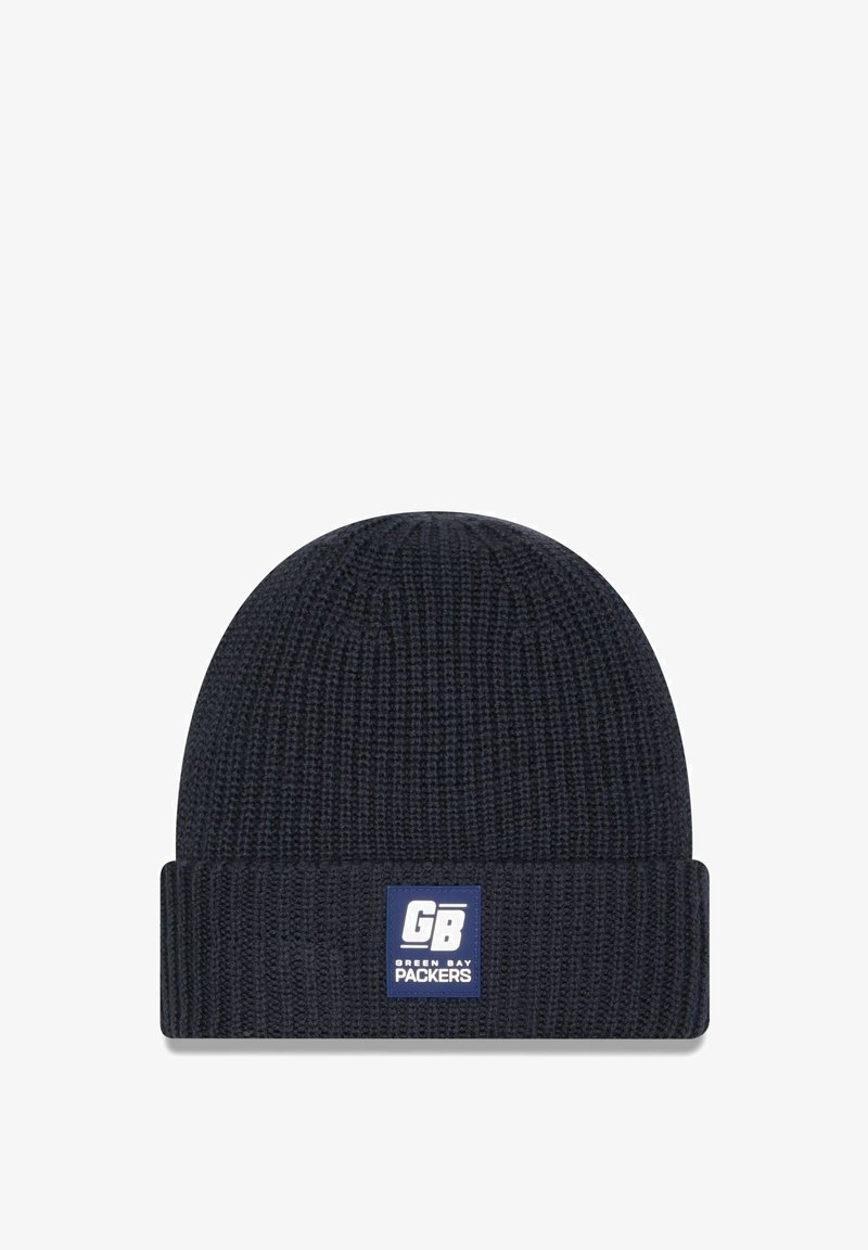 Marineblaue gestrickte Mütze mit gerippter Textur und umgeschlagenem Bündchen. Besitzt ein weiß-blaues Patch, das "GB" und das Logo der "Green Bay Packers" zeigt.