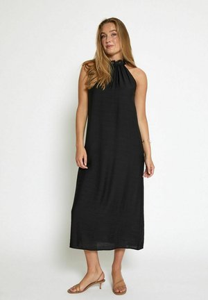 Black halter neck maxi dress with a textured fabric, featuring a gathered neckline and a loose, flowing silhouette.