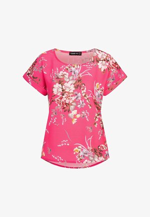Krátký rukáv s květinovým potiskem ve výrazné růžové barvě, s kulatým výstřihem, lehkou látkou a mírně zakřiveným lemem s dekorativními prvky.