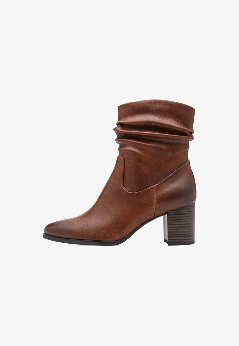 Botte en cuir marron mi-mollet avec une tige souple, un bout pointu et un talon bloc empilé.