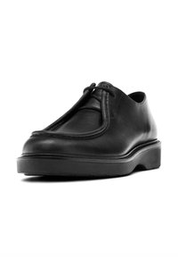 Black leather shoe with a rounded toe, minimalistic design, smooth texture, and a thick black rubber sole. Features a central lace closure.