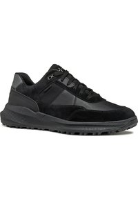 Black sneakers made of suede and leather featuring a textured sole, lace-up design, and discreet branding on the side.