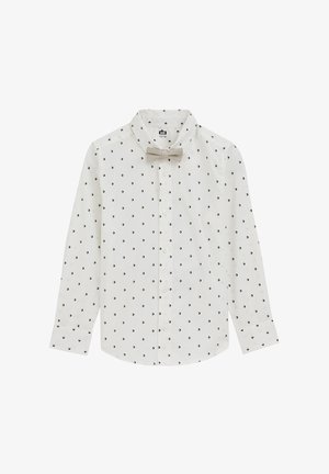 Fehér gombos ing világos bézs csokornyakkendővel. Egész felületen apró fekete geometriai minták díszítik. Hosszú ujjú, mandzsetta részletekkel.