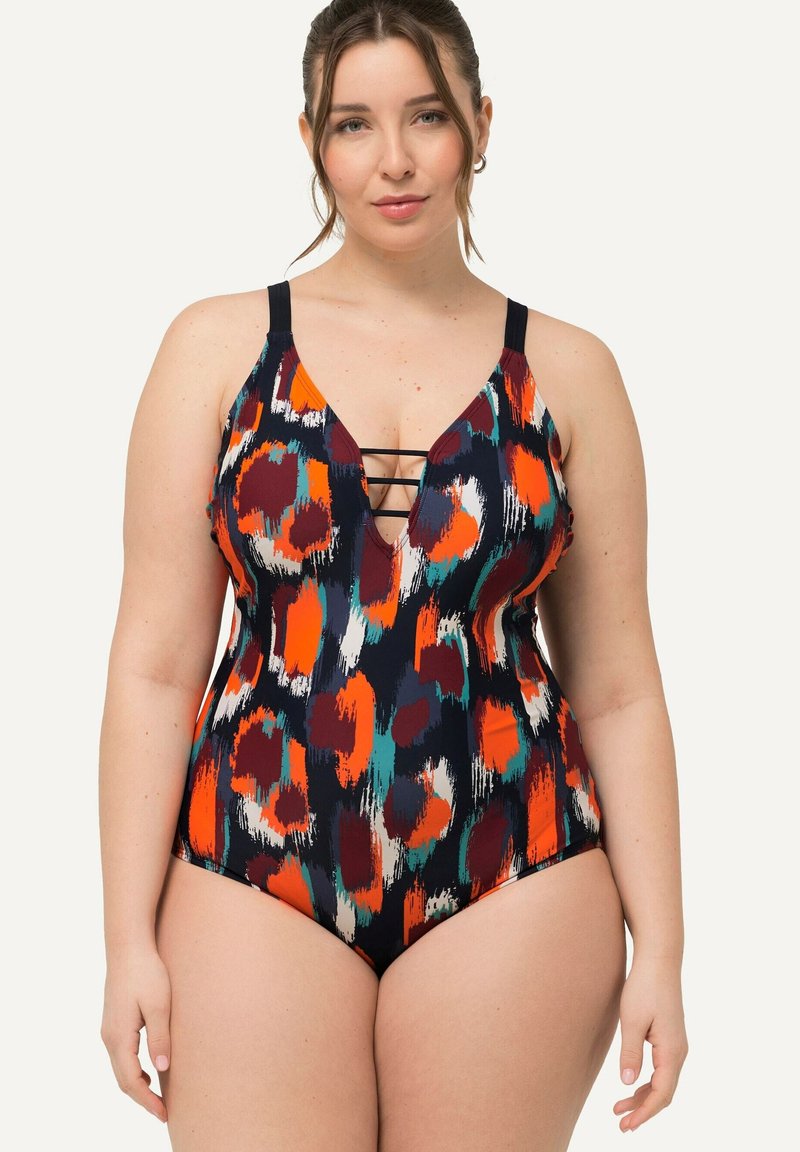 Maillot de bain une pièce avec un motif abstrait multicolore. Il présente un décolleté en V profond avec un détail croisé, des bretelles réglables et une silhouette ajustée.