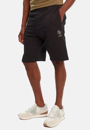 Pantalones cortos negros de mezcla de algodón, con cinturilla elástica y bolsillos laterales. Incluye un detalle de logotipo bordado en blanco en el muslo.