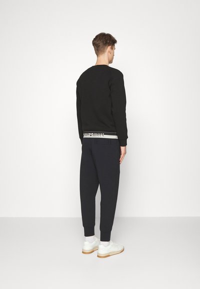 Emporio Armani TROUSER - Calças de fato de treino - blue navy