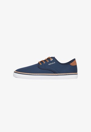 Navy blue canvas sneaker with brown laces, white sole, contrasting brown heel tab, and branded side detail "S.Oliver".