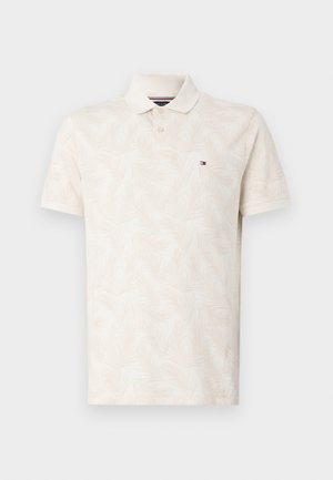 Gaišbeidzis polo krekls ar maigu lapu rakstu, īsām piedurknēm, klasisku apkakli un mazu logo kreisajā krūtī.