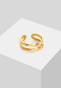 Goldfarbener verstellbarer Armreifring mit zwei ineinander verschlungenen Bändern, der eine glatte, reflektierende Oberfläche und ein minimalistisches Design aufweist.