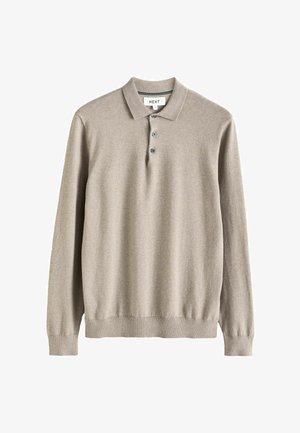 Beživi polo džemper dugih rukava proizveden od pletenog materijala. Ima ovratnik, placket sa tri dugmeta i rebraste manžetne i donji rub.