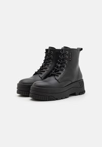 Tommy Jeans Stivaletti con plateau - black
