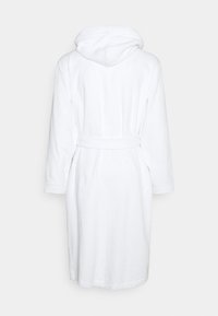 White terry cloth bathrobe with a hood, long sleeves, and a tie belt. Features textured fabric and side pockets. Simple and functional design.