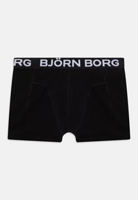 Boxer shorts negros de tela suave con una cinturilla elástica blanca que lleva el logo "BJÖRN BORG" y detallados cosidos para mayor durabilidad.