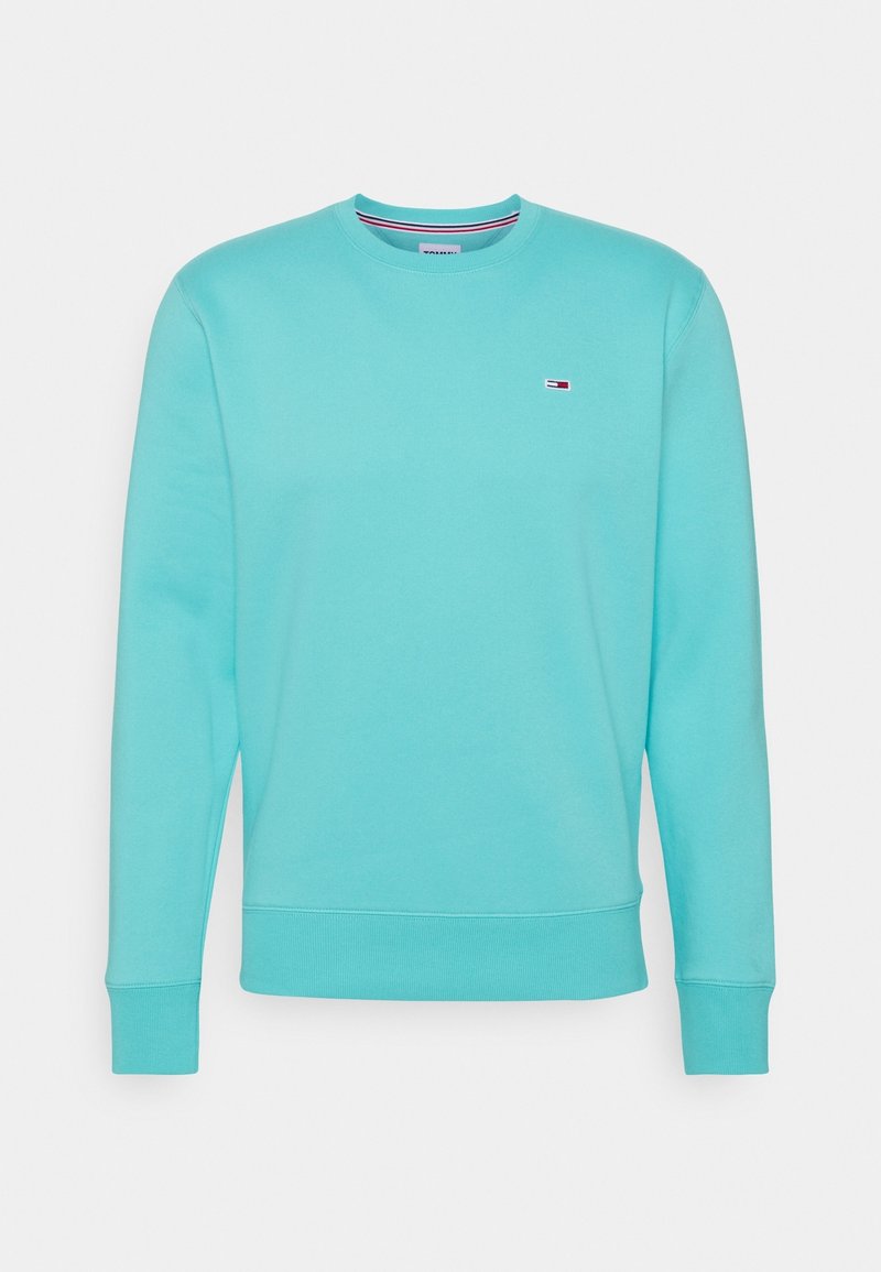 Sudadera de cuello redondo azul claro con mangas largas y un pequeño logotipo rojo, blanco y azul en el lado izquierdo del pecho.