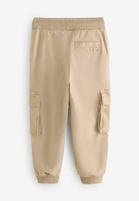 Beige cargobyxor med sidofickor, resårmidja och ribbade manschetter. Tillverkade av mjukt material med en slät textur.