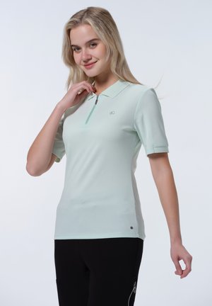 Light mint green polo shirt with short sleeves, a small zipper, collar, and subtle logo detail on the chest. Smooth texture and fitted design.