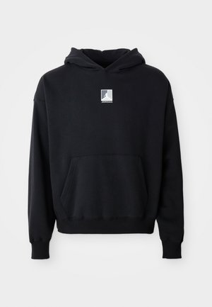 Black hoodie with front pocket and small white Jordan logo centered on the chest, displayed on a plain white background.