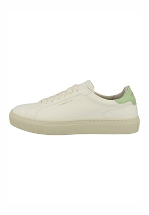 White leather sneaker with round toe, flat laces, soft green heel tab, minimally textured upper, and rubber sole. Branding on the side.
