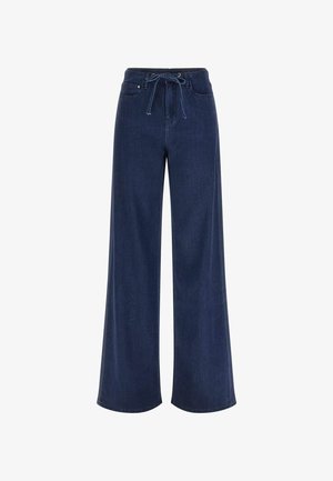 Weit geschnittene Jeanshosen in dunkler Waschung. Mit Kordelzugbund, fünf Taschen und glatter Textur. Klassisches Design mit klaren Linien.