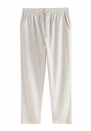 Pantaloni beige chiari, con vita elasticizzata e cordoncino, due tasche laterali, design a gamba dritta e texture della stoffa liscia.