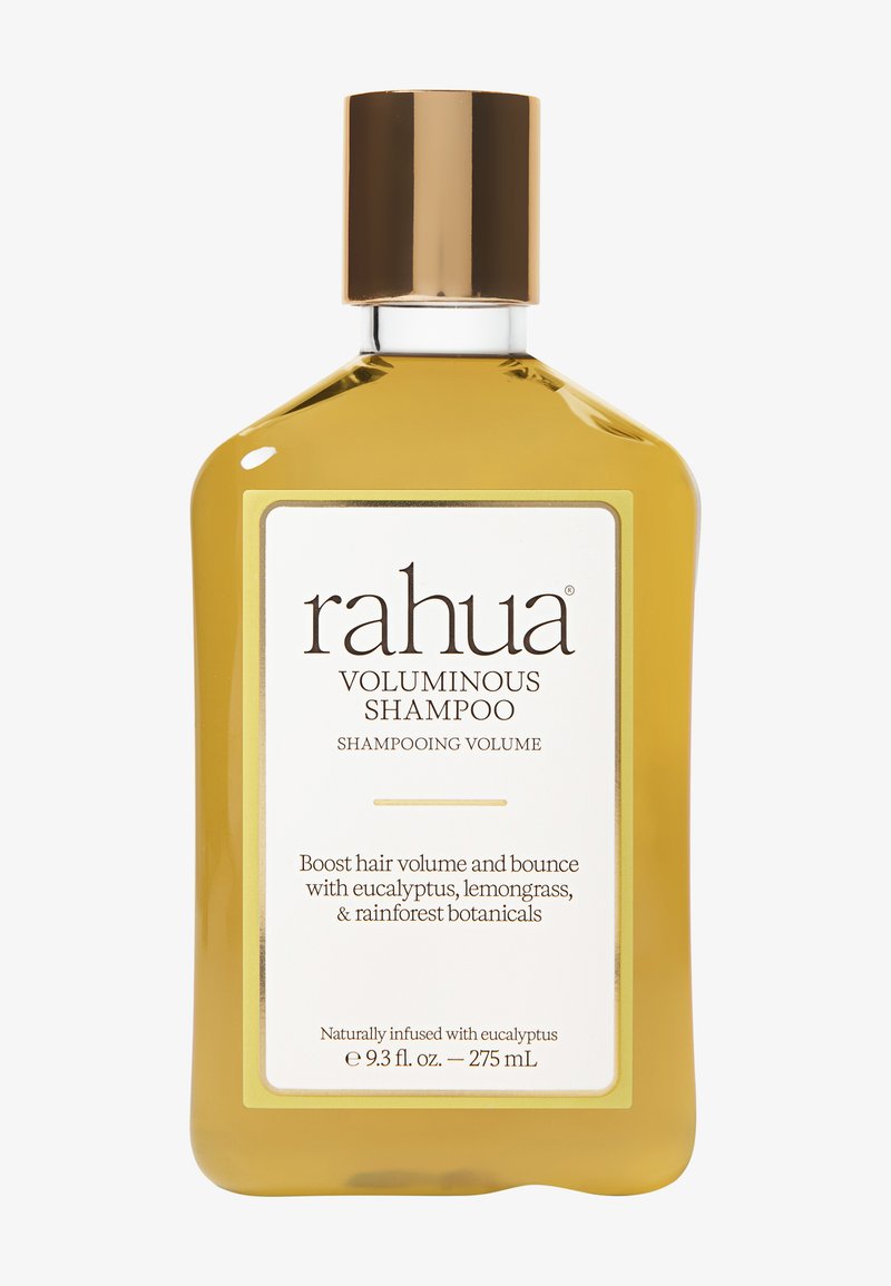 Shampoing volumisant Rahua dans une bouteille dorée avec bouchon doré, augmente le volume des cheveux grâce à l’eucalyptus, à la citronnelle et aux plantes de la forêt tropicale, 275 ml.