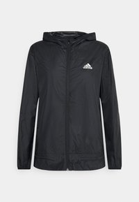 Giacca nera Adidas con zip e cappuccio, maniche lunghe e logo bianco Adidas sul lato sinistro del petto.