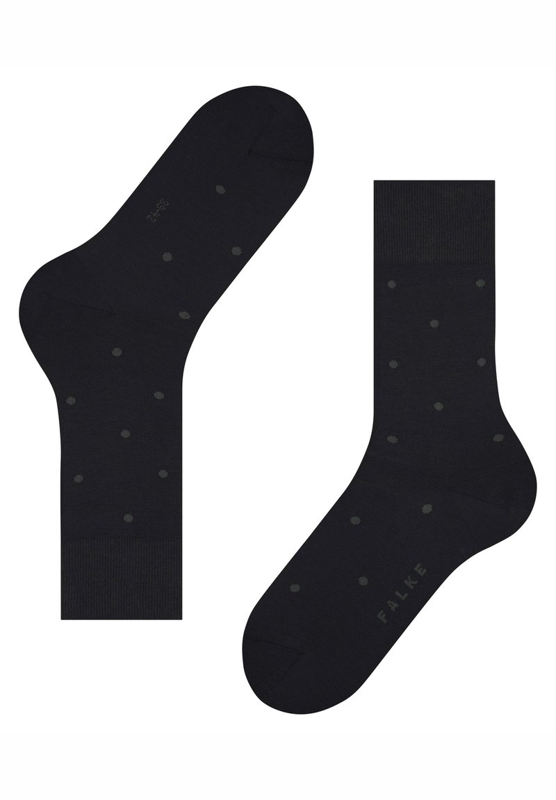 Μαύρες κάλτσες με λείο υφή και πράσινες πουά. Διαθέτουν άνετο τελείωμα και διακριτική επωνυμία κατά μήκος της σόλας.