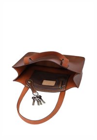 Borsa in pelle marrone con apertura superiore che mostra una tasca interna e un portachiavi con diverse chiavi attaccate all’interno.