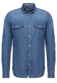 Jeansskjorta i blått, med knäppning fram, två bröstfickor och långa ärmar. Slät textur med en klassisk passform och sömnadsdetaljer.