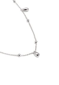 Collier en argent présentant un design alternatif de perles en forme de goutte lisses et de perles sphériques, reliées par une chaîne délicate.
