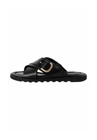 Black leather slide sandal featuring a cross-strap design, gold buckle detail, and a textured scalloped sole.