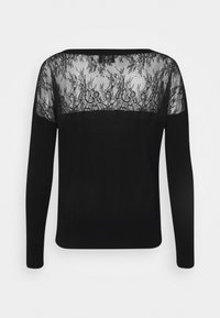 Schwarzer Pullover mit langen Ärmeln und einem Rückeneinsatz aus Spitze mit floralen Mustern, der eine Kombination aus Strick- und transparenten Texturen zeigt.