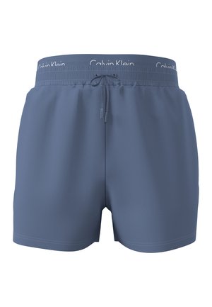 Bañadores cortos azules para hombre con cintura elástica, cordón y marca visible de Calvin Klein en la cintura interior.