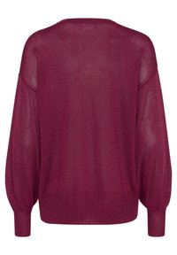 Pull surdimensionné bordeaux avec une texture douce et légère, épaules tombantes et manches longues ajustées. Présente des poignets côtelés et un col rond.