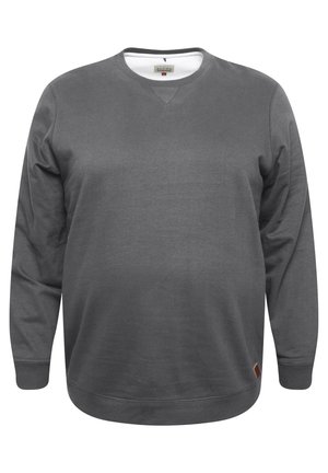 Grå crewneck sweatshirt lavet af blødt stof, med lange ærmer, ribbet kant og et lille accentmærke på den nederste venstre side.