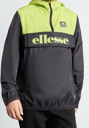 Czarna i limonkowo zielona kurtka przeciwdeszczowa ellas z półzamkiem i elastycznymi mankietami, noszona przez osobę od ramion do bioder.