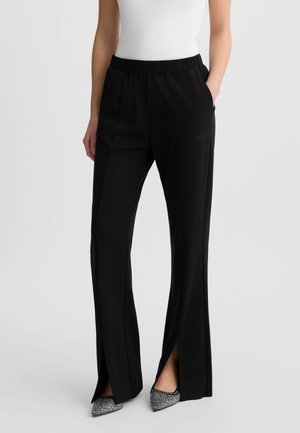 Spodnie materiałowe