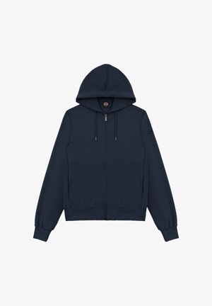 Tummansininen vetoketjullinen huppari nyöreillä, resorilla hihojen suissa ja helmassa sekä pienellä pyöreällä logopläjäyksellä vasemmassa hihassa.