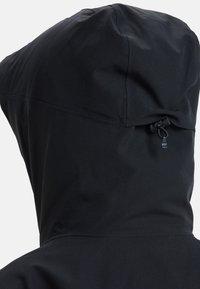 Black waterproof jacket with a hood, featuring a cinching toggle detail, smooth texture, and clean silhouette.